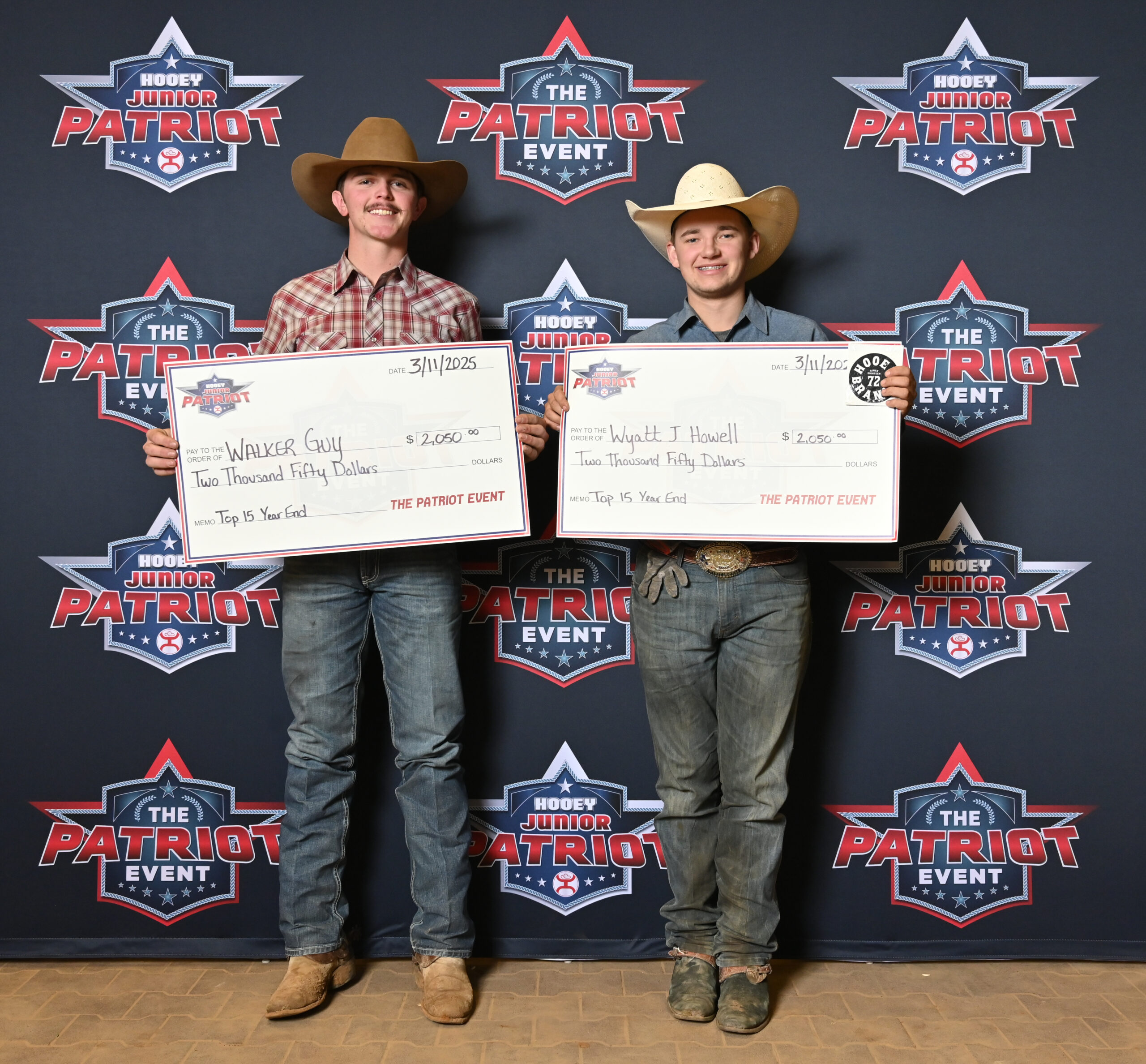 Two young rodeo competitors hold $2,050 prize checks at The Patriot Event awards backdrop