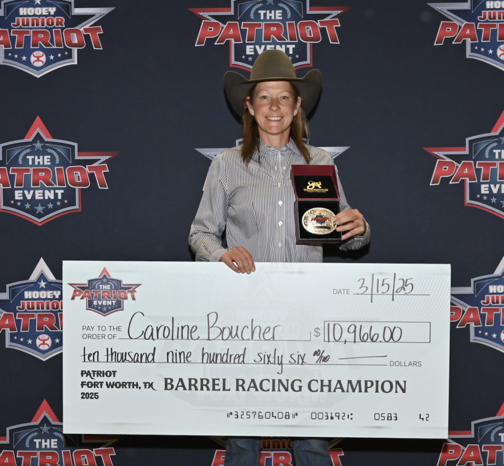 Caroline Boucher holds a ceremonial check for $10,906 and a belt buckle after winning the barrel racing championship at the Patriot Event in Fort Worth, Texas on February 15, 2025